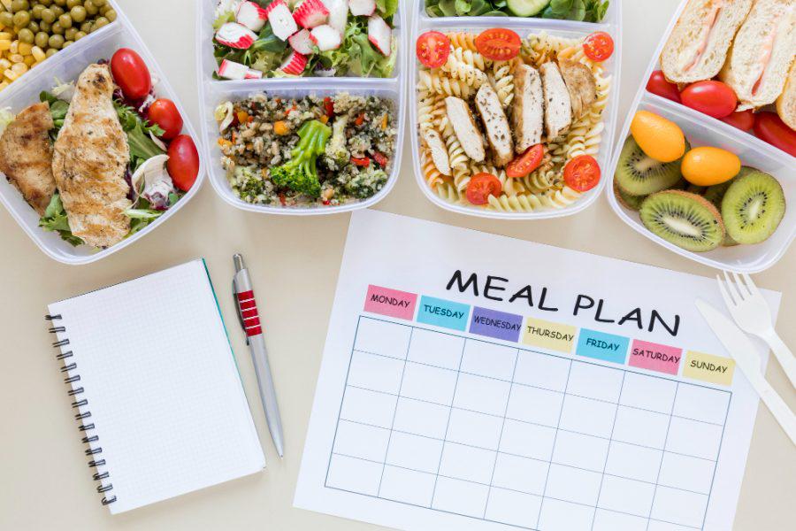 top-view-assortment-food-with-planner-e1623349695213.jpg