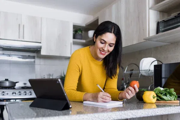 depositphotos_658957238-stock-photo-latin-adult-woman-cooking-writing.jpg